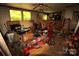 Cluttered living room features windows, fan, and various tools, boxes, and other items at 1320 Smith Woods Dr, Hickory Grove, SC 29717
