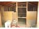 Interior view reveals a shed with chicken wire, wooden panels, and storage items, creating a functional space at 1320 Smith Woods Dr, Hickory Grove, SC 29717
