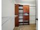 Walk-in closet featuring built-in shelving and wooden drawers and cabinets at 138 Montibello Dr, Mooresville, NC 28117
