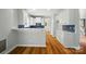 Modern kitchen featuring white cabinets, stainless steel appliances, and a breakfast bar with seating at 138 Montibello Dr, Mooresville, NC 28117