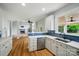 Eat-in kitchen with view to the living room, stainless steel appliances and breakfast bar at 138 Montibello Dr, Mooresville, NC 28117