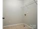 The laundry room features tile flooring, wire rack shelving, and utility connections at 138 Montibello Dr, Mooresville, NC 28117