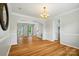 Open concept living room with arched entryway and hardwood floors throughout at 138 Montibello Dr, Mooresville, NC 28117