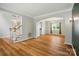 Open concept living room featuring hardwood floors and arched entryway at 138 Montibello Dr, Mooresville, NC 28117