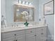 Elegant bathroom featuring double sinks, marble countertops, and modern fixtures at 144 Sea Trail Dr, Mooresville, NC 28117