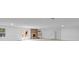Spacious living area features a brick fireplace and a white refrigerator at 144 Sea Trail Dr, Mooresville, NC 28117