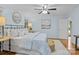 Serene bedroom featuring hardwood floors, a ceiling fan, and abundant natural light at 144 Sea Trail Dr, Mooresville, NC 28117