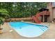 Backyard swimming pool with a diving board and an elevated deck with a canopy at 144 Sea Trail Dr, Mooresville, NC 28117