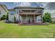 A spacious backyard features a two-story deck, perfect for entertaining and outdoor enjoyment at 14503 Crest Ct, Charlotte, NC 28278