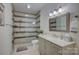 Modern bathroom with a tiled glass door shower, white countertops, and updated fixtures at 14503 Crest Ct, Charlotte, NC 28278