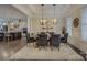 Elegant dining room featuring stylish lighting, neutral color palette, and hardwood floors at 14503 Crest Ct, Charlotte, NC 28278