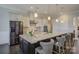 Open-concept kitchen with large island, stainless steel appliances, and barstool seating at 14503 Crest Ct, Charlotte, NC 28278