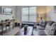 Cozy living room features a comfortable gray sofa, desk, and stylish decor at 14503 Crest Ct, Charlotte, NC 28278