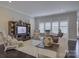 Comfortable living room showcasing built-in shelving and lots of natural light at 14503 Crest Ct, Charlotte, NC 28278