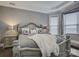 A cozy main bedroom featuring stylish decor, a comfortable bed, and soft lighting at 14503 Crest Ct, Charlotte, NC 28278