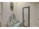 Attractive vanity area with neutral colors, makeup table, and a full-length mirror at 14503 Crest Ct, Charlotte, NC 28278