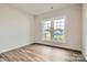 Bedroom featuring hardwood floors and a large window at 1528 Croydon St, Indian Land, SC 29707
