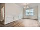 Formal dining room with wainscoting and hardwood floors at 1528 Croydon St, Indian Land, SC 29707