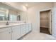 Bathroom featuring double vanity, modern fixtures, and a walk-in closet at 1528 Croydon St, Indian Land, SC 29707