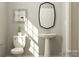 Cozy powder room featuring a pedestal sink and stylish decor, providing a functional and elegant space at 1541 Croydon St, Indian Land, SC 29707