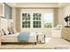 Bedroom features a large window with curtains, a bed with pillows, and a chair at 1541 Croydon St, Indian Land, SC 29707