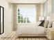 This bedroom features a large window, neutral color palette, and a comfortable-looking bed at 1541 Croydon St, Indian Land, SC 29707