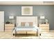 Bedroom featuring a bed with upholstered headboard, side tables with lamps, and a bench at 1541 Croydon St, Indian Land, SC 29707