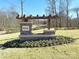 Community entrance sign with stone pillars and decorative landscaping at 1541 Croydon St, Indian Land, SC 29707