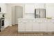 Bright kitchen with white cabinets, subway tile backsplash, and modern appliances, offering a clean design at 1541 Croydon St, Indian Land, SC 29707