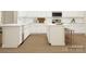 Modern kitchen with white cabinets, stainless steel appliances, and a functional island, perfect for cooking at 1541 Croydon St, Indian Land, SC 29707