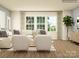 Bright living room featuring a comfortable sofa, and large windows, great for relaxing and entertaining at 1541 Croydon St, Indian Land, SC 29707