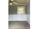 Cozy bedroom featuring neutral carpet, white wainscoting, and a window with natural light at 157 5Th N Ave, Taylorsville, NC 28681