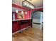 Dining room featuring stone arch, breakfast bar, wood flooring, and modern lighting at 157 5Th N Ave, Taylorsville, NC 28681