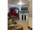 Unique kitchen area with stone accents, tile floor, and dark cabinets, creating a distinctive style at 157 5Th N Ave, Taylorsville, NC 28681