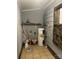 Functional utility room featuring a water heater, stone accent and some storage solutions at 157 5Th N Ave, Taylorsville, NC 28681