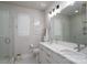 Bathroom featuring double sinks, a large mirror, and a glass-enclosed shower at 1707 Cannon View Ln, Charlotte, NC 28208