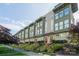 Attractive townhouse complex with landscaped front yards, red doors, and a sidewalk at 1707 Cannon View Ln, Charlotte, NC 28208