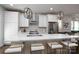 Contemporary kitchen featuring white cabinets, marble countertops, and stainless steel appliances at 1707 Cannon View Ln, Charlotte, NC 28208