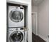 Convenient laundry area with stacked washer and dryer units, maximizing space and efficiency at 1707 Cannon View Ln, Charlotte, NC 28208