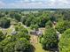 Aerial shot of a home nestled in a lush, green neighborhood, offering privacy and tranquility at 1818 Winfield Dr, Monroe, NC 28110