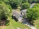 An aerial view showcases this house with well-maintained lawn, landscaping, and a driveway at 1818 Winfield Dr, Monroe, NC 28110
