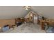 Inviting attic space featuring carpet flooring, neutral walls, shelving and a doorway at 1818 Winfield Dr, Monroe, NC 28110