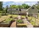 Spacious backyard featuring a large lawn and multiple garden beds, perfect for gardening enthusiasts at 1818 Winfield Dr, Monroe, NC 28110