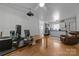 Bright bedroom boasts hardwood flooring, a ceiling fan, and a nice view at 1818 Winfield Dr, Monroe, NC 28110