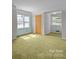 Bright bedroom featuring two windows providing ample natural light at 1818 Winfield Dr, Monroe, NC 28110