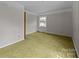 Spacious bedroom featuring a window providing ample natural light at 1818 Winfield Dr, Monroe, NC 28110