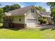 Exterior view showcasing the home's garage and well-maintained lawn at 1818 Winfield Dr, Monroe, NC 28110