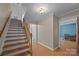 Inviting hallway showcasing hardwood floors and staircase to the upper level at 1818 Winfield Dr, Monroe, NC 28110