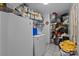The laundry room features tile flooring, washer, dryer and metal storage shelves at 1818 Winfield Dr, Monroe, NC 28110