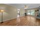 Spacious living room features hardwood flooring, a fireplace and natural light at 1818 Winfield Dr, Monroe, NC 28110
